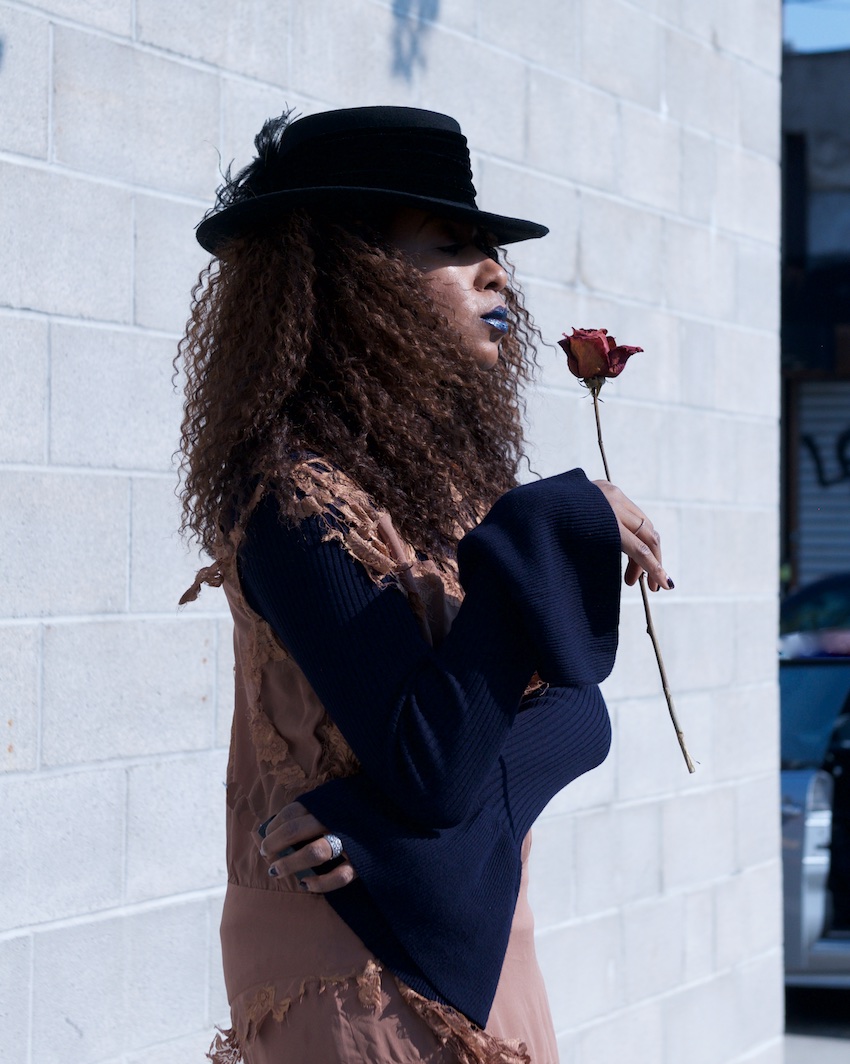 bell sleeve knit top and fedora with NYX dark nebula metal lipstick